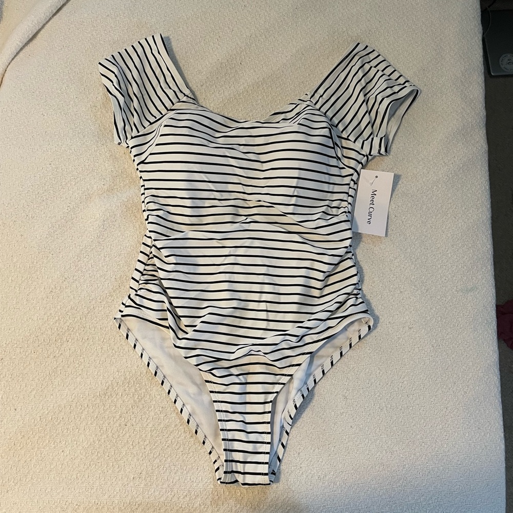 White with black stripe. Size Medium